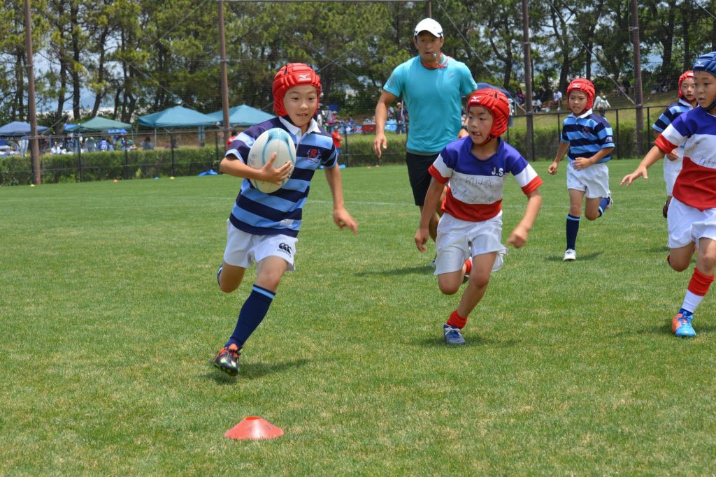 Photos of little children playing rugby